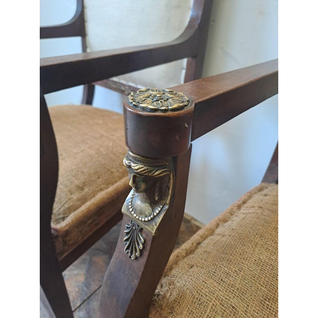 A handsome pair of French Empire style armchairs in mahogany, dating to around 1900. Of classical form, they feature...