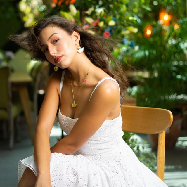 Step into the mystique of ancient royalty with the Cleopatra Sunburst Turquoise Gold Necklace. This bold statement piece...