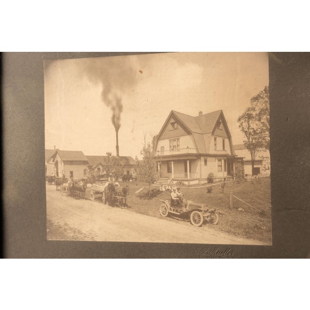 Framed antique sepia photograph of a Wisconsin street at the turn of the century.