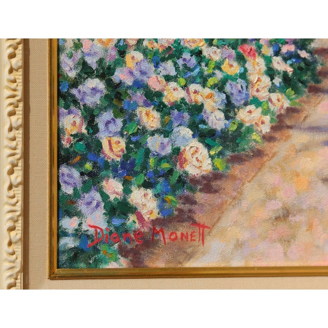 Diane Monet's exquisite landscape features blooming flower bushes and rolling clouds that enhance the idyllic beauty of...