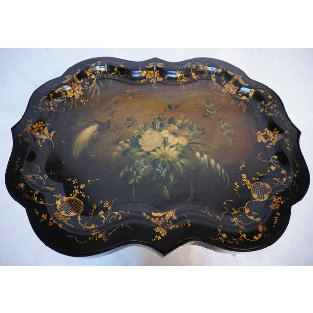 Regency Black Lacquered Papier-Mache Tray Table The tray is Circa the 19th Century and is installed on a later stand. The...