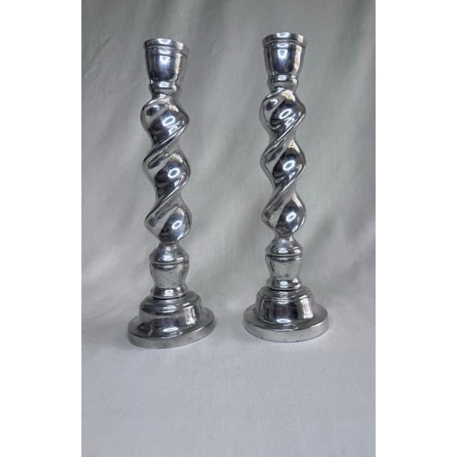 This pair of vintage candlesticks feature a striking barley twist stem that mimics a classic-open-helix design. The silver...