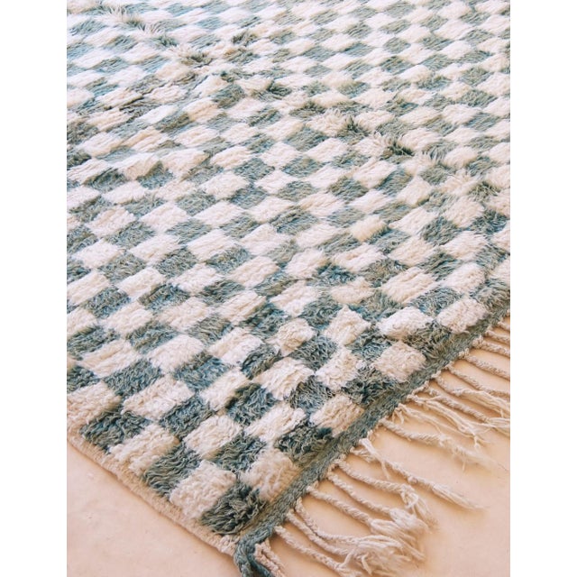 Modern Moroccan Checkered Rug – Soft Green & Ivory Wool This modern Moroccan rug features a simple checkered pattern in...