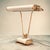 What a beautiful table lamp, a relic of the art deco era, made of brass and gray lacquered sheet metal. The design is...