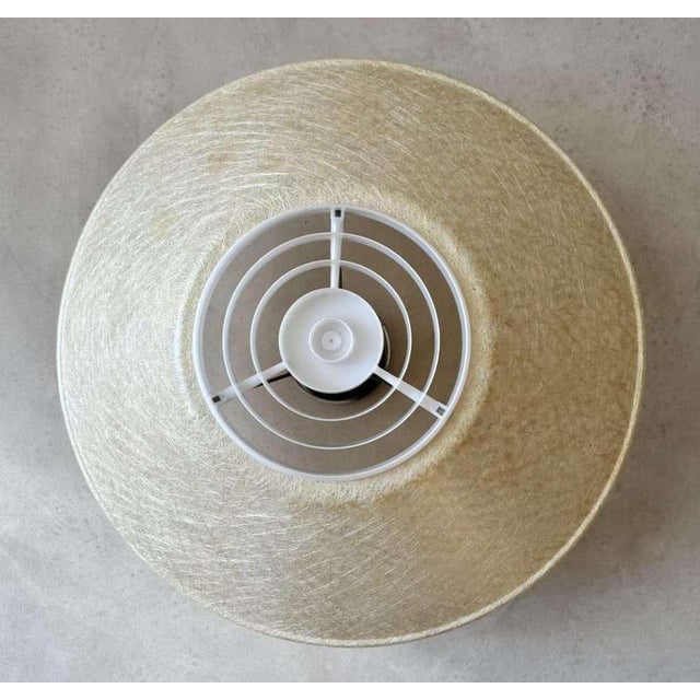 This ceiling lamp was designed in the 1950s by Louis Kalff for Philips. The design reflects the functional and progressive...