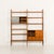 Visually appealing and extremely functional, this freestanding teak wall unit was most likely designed and produced in...