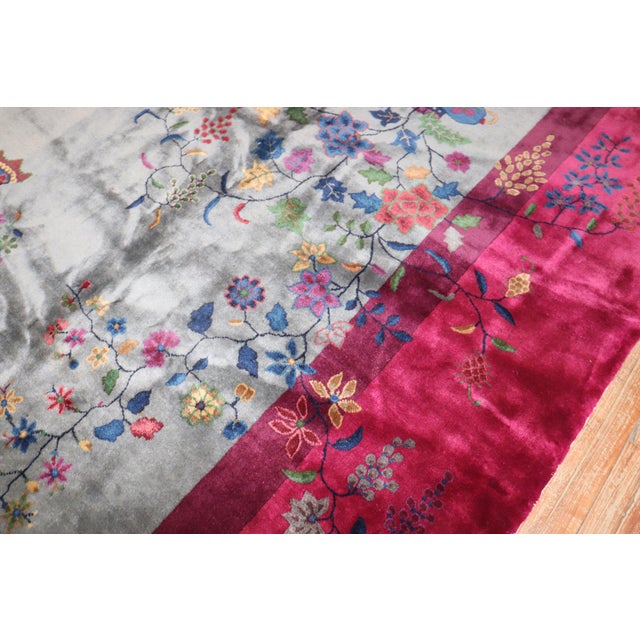 Stunning large Chinese Art Deco rug with a beautiful floral design on a grey field and plum border. Most found in Room...