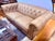 A classic Bernhardt leather loveseat with the timeless appeal of a Chesterfield silhouette. Upholstered in a warm camel-...