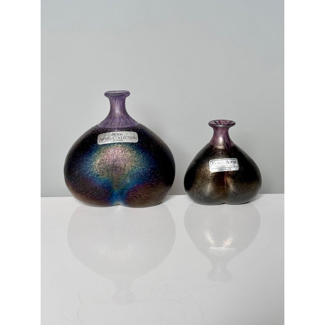 These two miniature art glass vases from the Volcano series were designed by glass artist Bertil Vallien in 1981 for the...