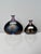 These two miniature art glass vases from the Volcano series were designed by glass artist Bertil Vallien in 1981 for the...