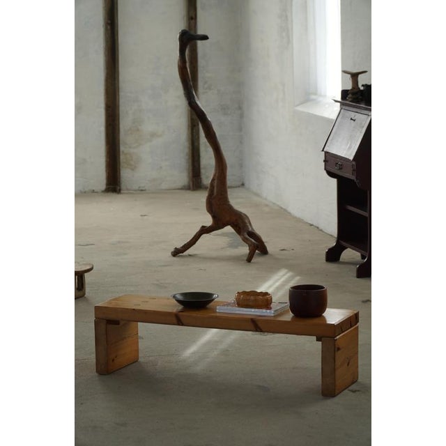 A timeless vintage brutalist side table / bench in solid pine, crafted in Sweden during the 1970s. Exemplifying the...