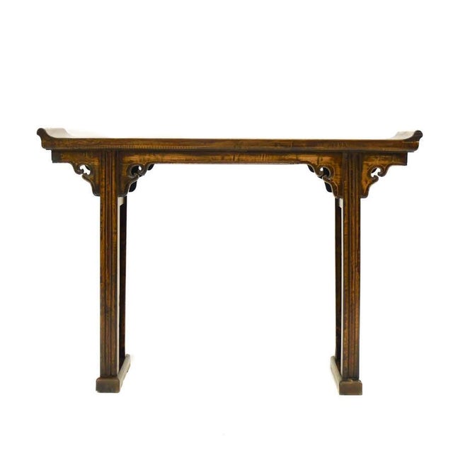 This Chinese wooden altar table exemplifies the understated elegance and balanced proportions characteristic of...