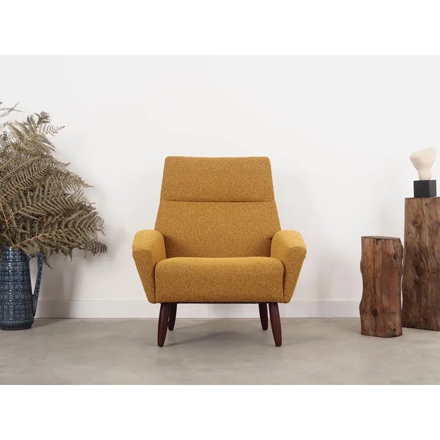 The armchair was made in the 1970s, Danish production. The structure is made of teak wood. The wood has been refreshed....