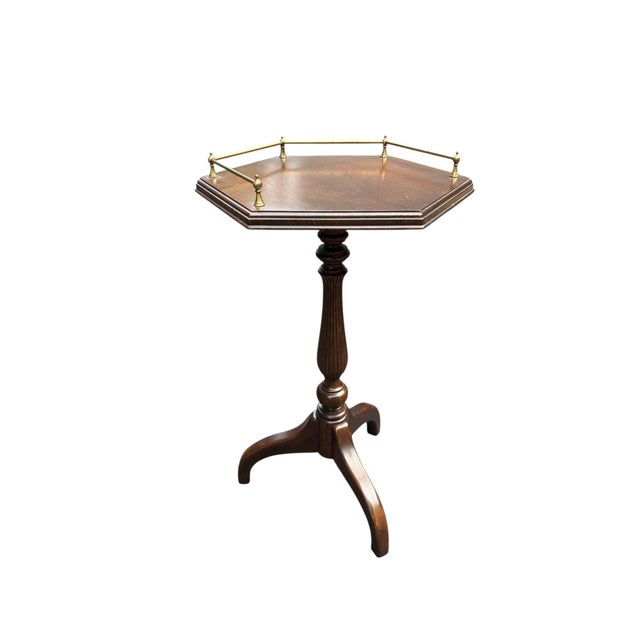 Ethan Allen Hexagon Side Table with Brass Rail This solid wood six sided table has brass rails on four sides. There is a...
