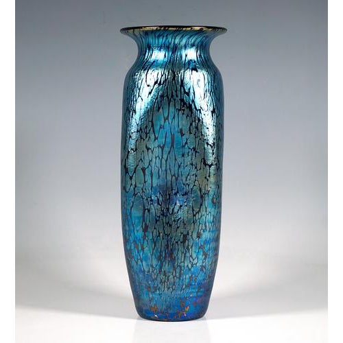 Exceptional Bohemian Art Nouveau glass vase: Mould blown into a slender, slightly bulbous vase body with a flush base,...