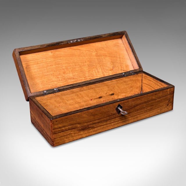 This is an antique ladies garden seed box. An English, walnut and boxwood inlaid greenhouse storage case, dating to the...