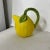 Lemon mold pitcher with green vine handle and leaves. Goes well with cabbageware and other green majolica/ceramics....