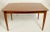 Architectural, sophisticated midcentury dining table by noted English maker Gimson and Slater, retailed by Heals of...
