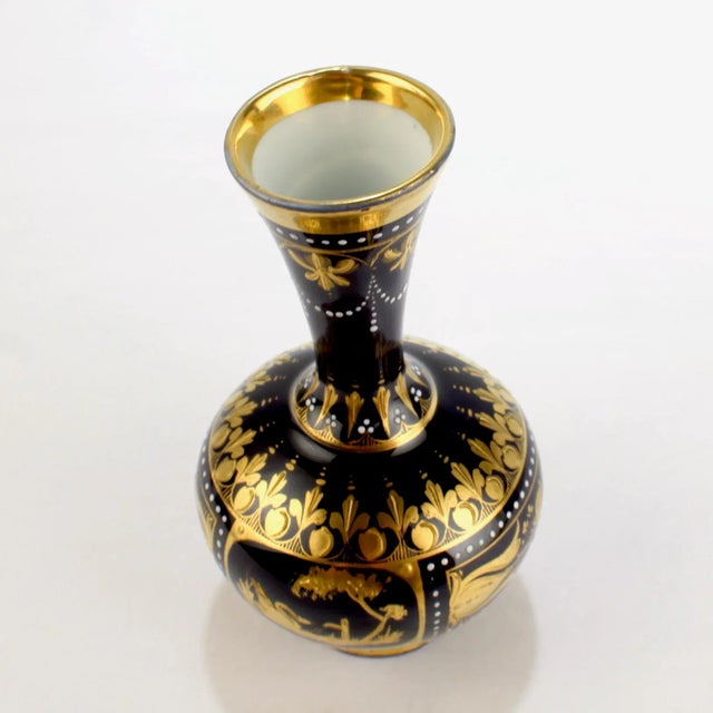 A signed antique Royal Vienna style porcelain vase. Entitled "Geheimnis", which translates in English as "Secret". It has...