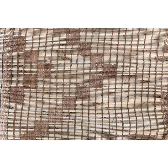 This striking 1950s Moroccan Tuareg rug exemplifies the graphic elegance and nomadic craftsmanship of Tuareg weaving...