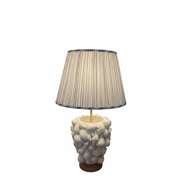 A contemporary table lamp, handcrafted in Italy. A celebration of coastal elegance and fine Italian artistry, this lamp...