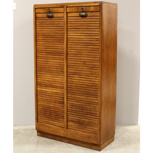 Double-shutter filing cabinet Made of oak First half of the 20th century Dimensions: width 84 cm, depth 36 cm, height 150...