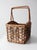 This vintage handmade basket combines woven wicker with natural birch bark panels for a warm, rustic look. The rectangular...
