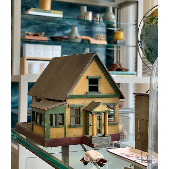 Charming Vintage Folk Art Dollhouse. Wood construction with painted sides and trim. The right side of the house is open...