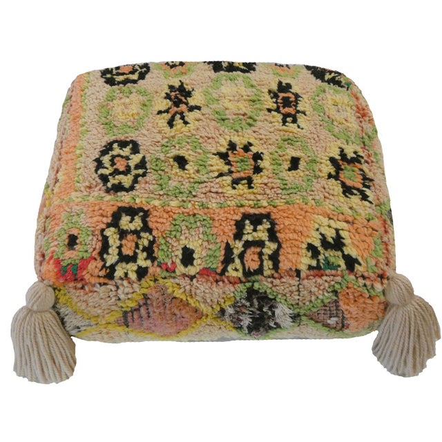 Moroccan floor pouf made from an abstract midcentury rug handwoven in cream, peridot green, yellow, apricot and black...