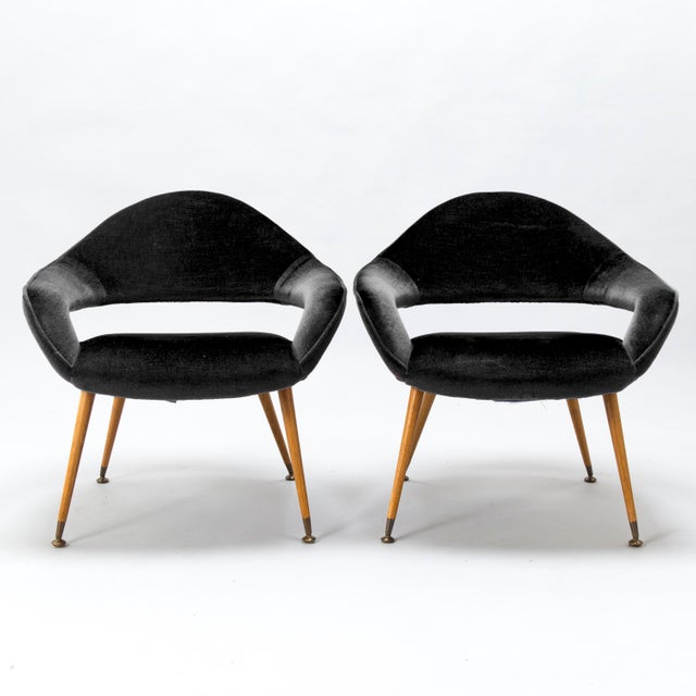 A pair of DU 55 P lounge chairs designed by Gastone Rinaldi and produced by RIMA in Italy. These have a very light, open...