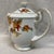 Golden Autumn Tea Pot featuring colored Autumn leaves and gold trim on a white porcelain body. Made in Japan. This tea pot...