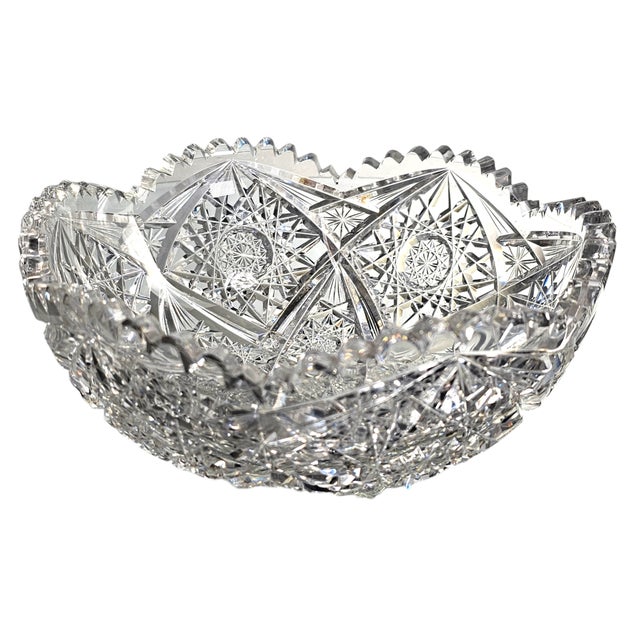This "American Brilliant Period" cut glass bowl features a striking intersecting star pattern and saw tooth edge, this...