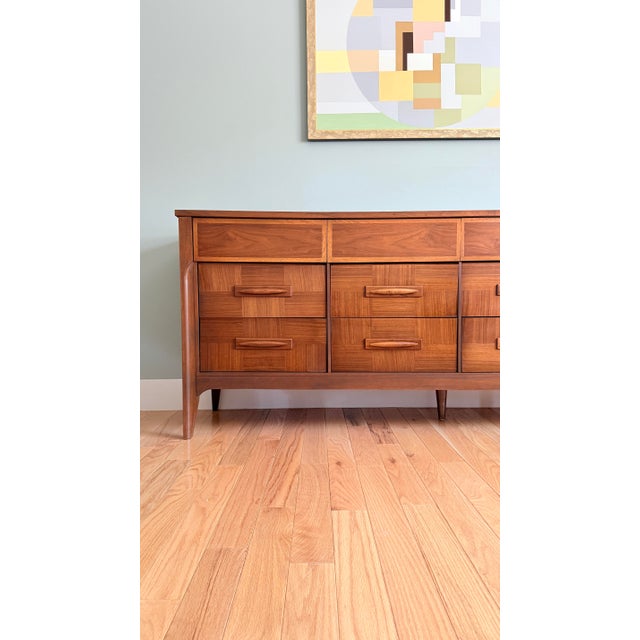 Refinished and thoroughly restored. Extra-long lowboy dresser by Very Best Furniture Co., 1965. Featuring an impressive 12...