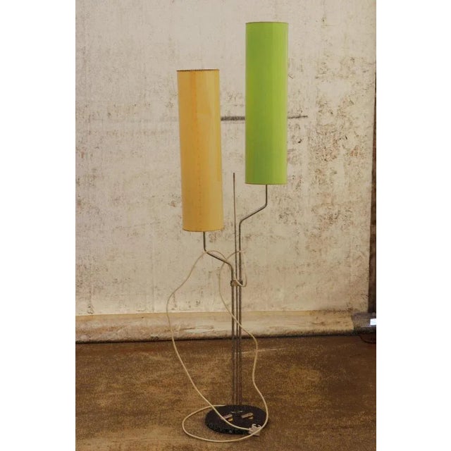 This standing lamp is a typical example of Mid-Century Czechoslovak design. This design associated with the “Brussels...