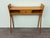 Vintage console table made in Italy in the 1960s. Elegant piece with a beech wood frame. This wooden console table...