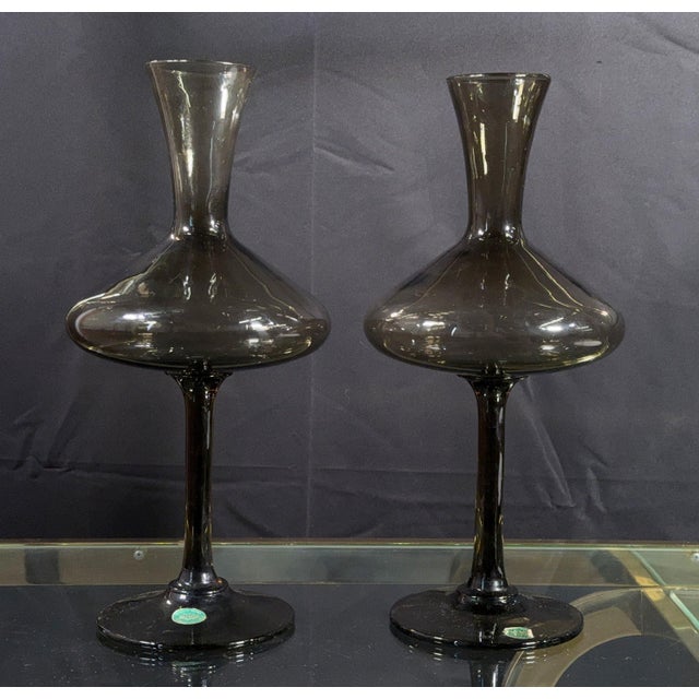 This pair of handmade Italian smoked glass vessels by Balboa combines a wide flared decanter body with a tall slender stem...
