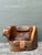 Embrace the raw beauty of the natural world with this extraordinary primitive barrel chair, expertly hand-carved from a...