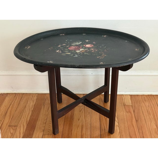 Victorian antique papier mâché tea tray with hand-painted flowers and imbedded mother-of-pearl on a black background....