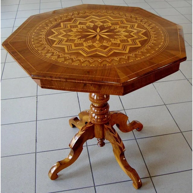Octagonal table, Italian, Rolo An Italian walnut and parquetry centre table, Rolo, early 19th Century The circular top...