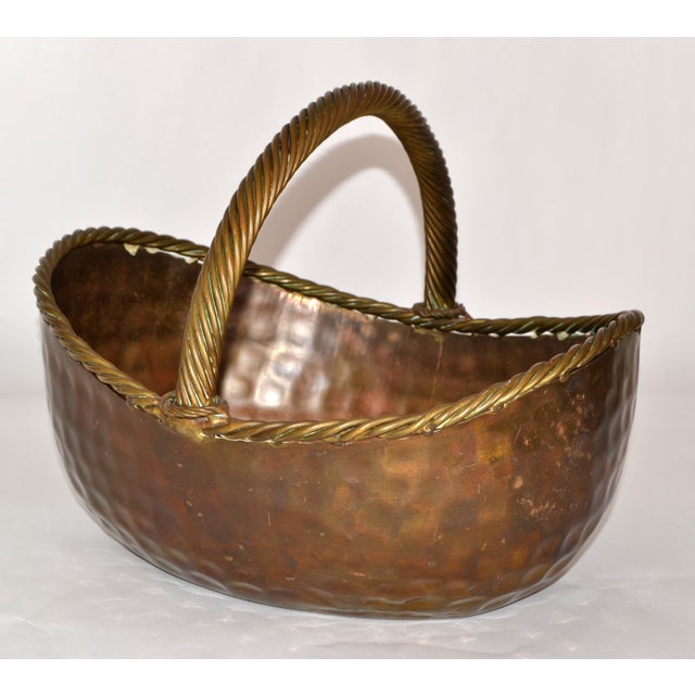 Mid-20th Century Arts & Crafts hammered and forged Brass Planter Basket. Heavy Craftsmanship aged in a warm Patina, which...