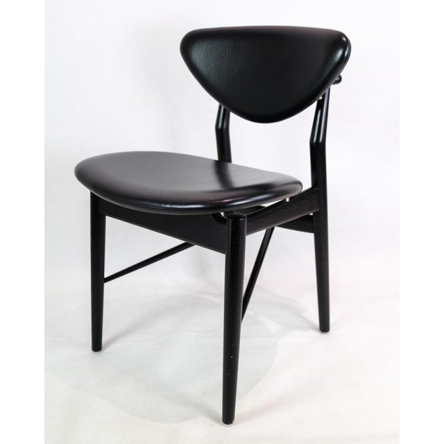 Model 108 Chair, designed by Finn Juhl in black painted oak with black elegance leather of the highest quality produced by...