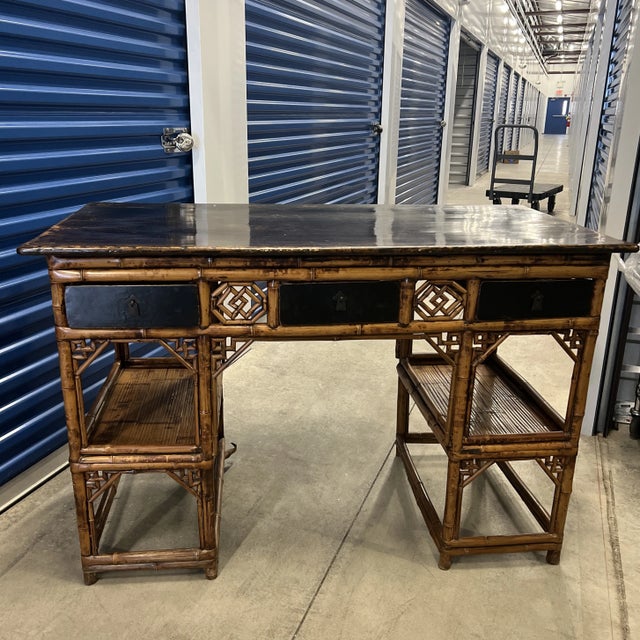 Antique 19th Century Chinese Rattan Desk With Fretwork Detail From a Watch Hill, RI estate. 25” high 22” wide Knee hole