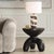 This Striking Accent Table Features A Unique Organic Design, Crafted From Man-made Stone With Playfully Shaped Legs That...