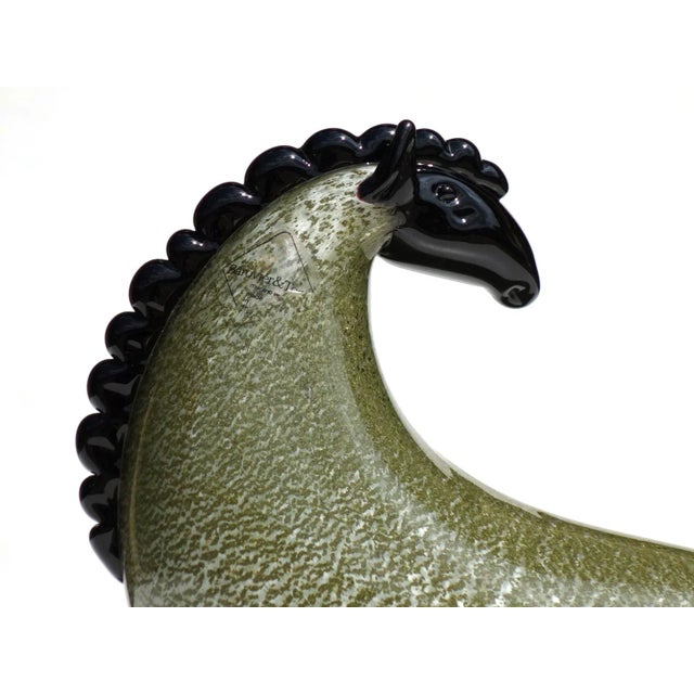 This green glass horse designed by Toni Zuccheri was produced in 1988 by Barovier & Toso. Labeled by Maker,This piece has...