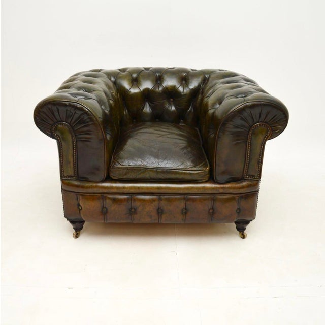 A large and very impressive antique Victorian leather Chesterfield armchair. This was made in England, we would date it to...