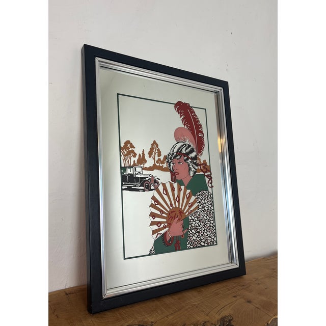 The artwork mirror is titled "Au Revoir" and it is a famous Art Deco fashion illustration by the French artist George...