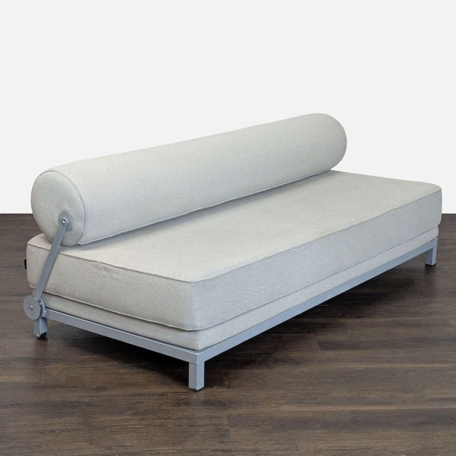 This Softline sleeper sofa offers both seating and sleeping options in a modern, simple design. The neutral upholstery...