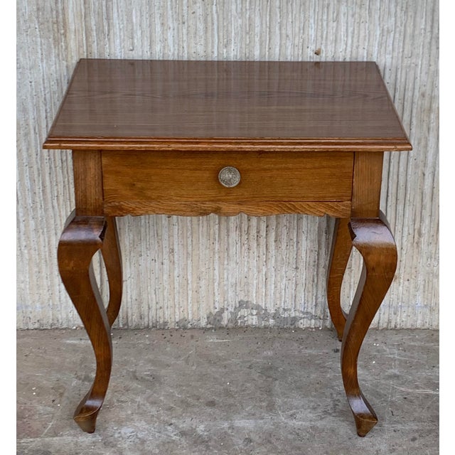 20th-century pair of Spanish nightstands with two carved drawers and iron hardware. Beautiful tables that you can use like...