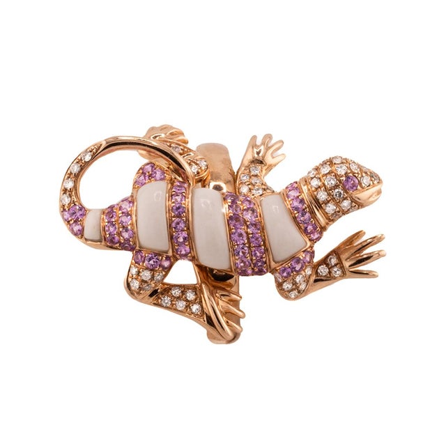 18k Rose gold salamander ring with white onyx and 52 round pink sapphires weighing approximately 1.50 carats and 61 eound...