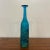 Blue textured Mdina Ming glass bottle. Signature on bottom.